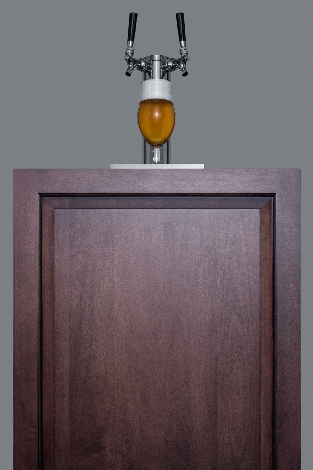 Built-in undercounter ADA height commercially listed dual tap beer dispenser with stainless steel wrapped door and black cabinet